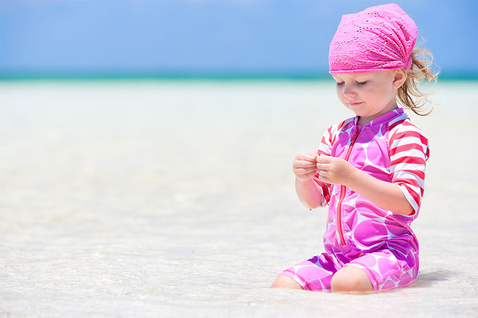 Little girl on beach in the Cayman Islands
